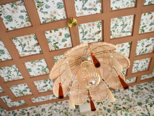 a chandelier hanging from a ceiling in a room at YHA Windermere in Troutbeck