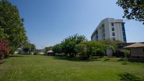 a large yard in front of a building at Fairways Hotel Kisumu in Kisumu
