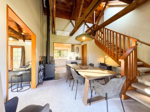 a dining room with a table and chairs at Glenorchy Lake House in Glenorchy