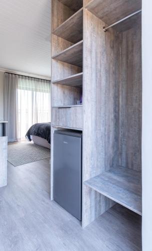 a kitchen with a refrigerator in a room at A' Queenslin Guesthouse in Paarl