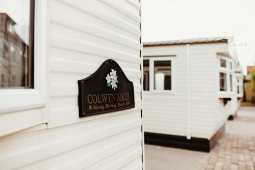 a sign for a country wedding on the side of a building at Villa Hexenholz in Thale