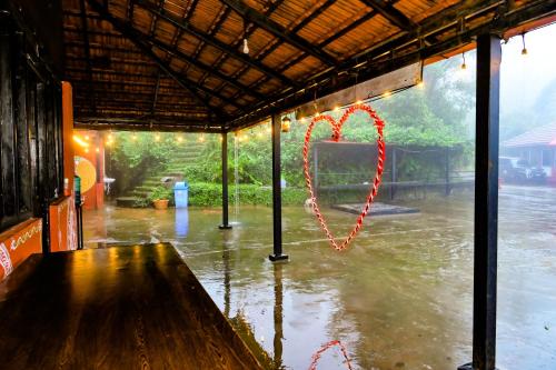 a heart drawn on a window in the rain at Kumbles Misty Mount in Attigundi