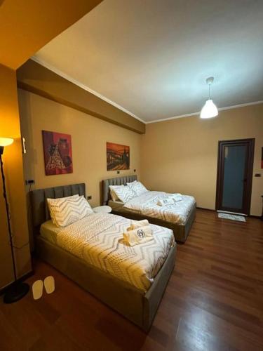 Ένα ή περισσότερα κρεβάτια σε δωμάτιο στο Prestige Hotel