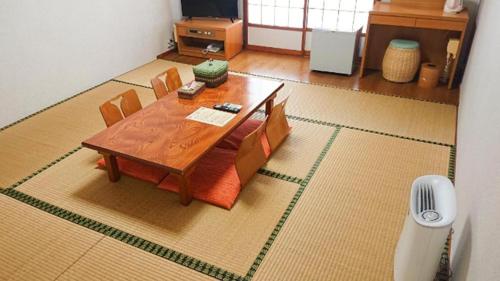 a miniature table and chairs in a living room at Hotel Thida No Sato in Miyako Island