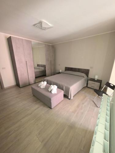 a large bedroom with a bed and a couch at Casa Vacanza da Patty in San Rufo