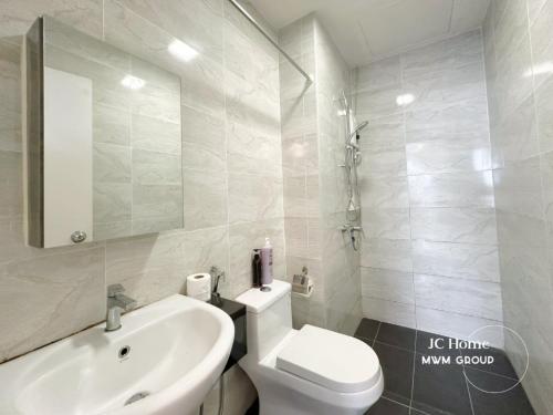 a white bathroom with a sink and a toilet at SKS Pavilion Town House By MWM Johor Bahru in Johor Bahru