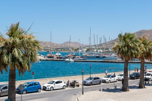 a group of cars parked next to a marina at Hotel Oasis in Parikia