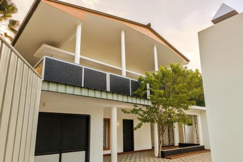 a house with a solarium on the roof at Jaffna Rockland in Jaffna