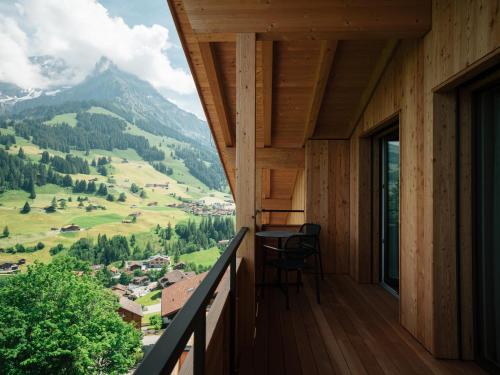 a balcony with a view of a mountain at KURVE Apartments & Lounge in Adelboden