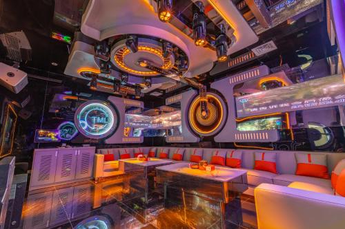 a restaurant with a motorcycle hanging from the ceiling at TML-6 bedrooms-independent swimming pool and Luxury KTV room and fitness area and pool table in Ban Huai Yai
