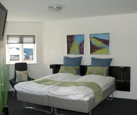 Postel nebo postele na pokoji v ubytování Seaside Hotel Thyborøn