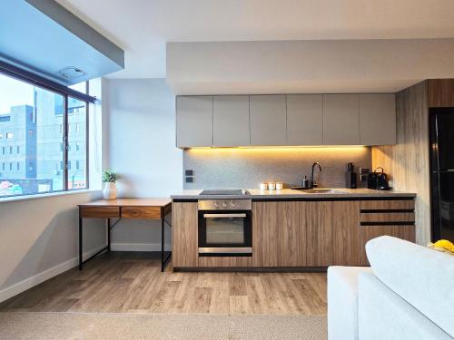 a kitchen with a sink and a counter top at Central Lower Hutt 2BR Stay in Lower Hutt
