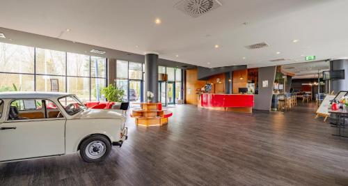 an old car parked in the middle of a room at Best Western Plaza Hotel Zwickau in Zwickau