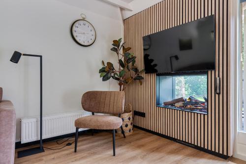 TV a/nebo společenská místnost v ubytování RCN het Grote Bos
