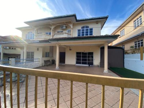 a house with a fence in front of it at Casa D' Bernam in TanjongMalim
