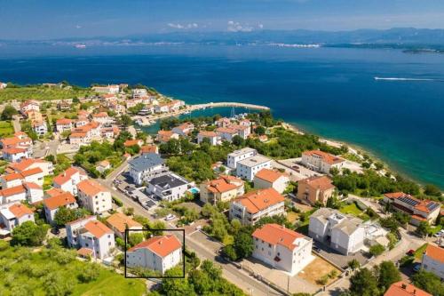 an aerial view of a town next to the water at Apartments Ruza in Porat