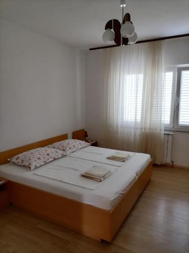 Ένα ή περισσότερα κρεβάτια σε δωμάτιο στο Apartments Poldan