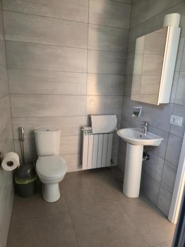 a bathroom with a toilet and a sink at Orion, Hills of Zaarour in Zaarour