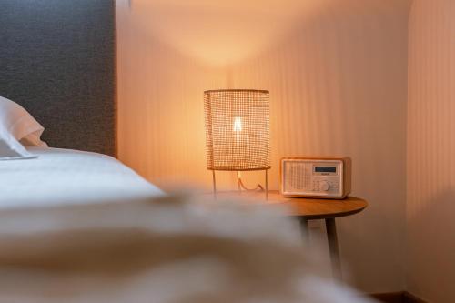 Ein Bett oder Betten in einem Zimmer der Unterkunft Huswell - Two guest-rooms in stylish villa - free bikes