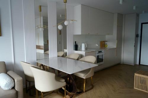 En eller flere senge i et værelse på Apartament Gdynia Żeromskiego