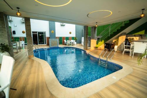 a large swimming pool in a hotel room at Presken Hotels, Awolowo Way, Ikeja in Ikeja