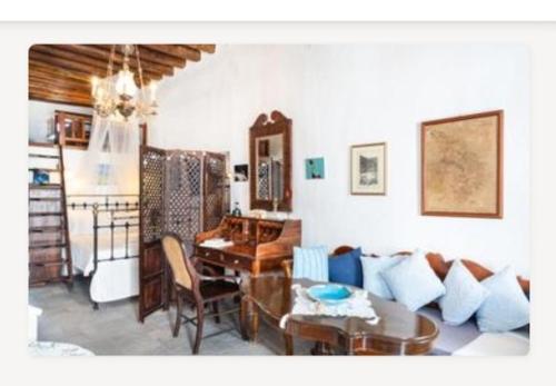 a living room with a couch and a table at eleni's cozy appartment in Kastron