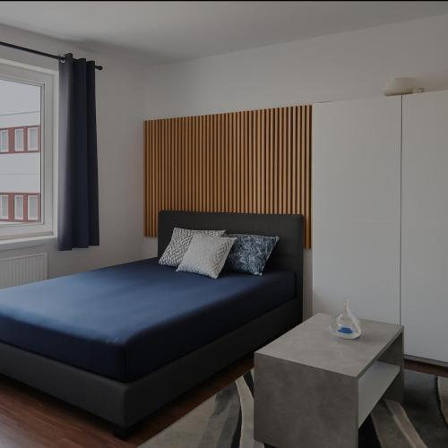 En eller flere senge i et værelse på CityNest Hannover O9
