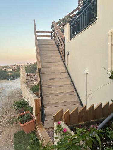 a set of stairs leading up to a house at Kallithea View in Prasás