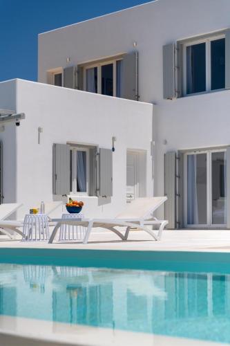 a villa with a swimming pool and a house at Villa Lilak in Finikas