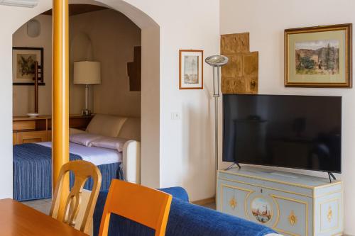 Μια τηλεόραση ή/και κέντρο ψυχαγωγίας στο The Balcony Suite - Piazza del Campo