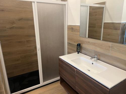 a bathroom with a sink and a mirror at Locanda Zita in Sestola