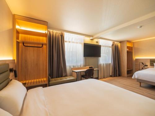 Postel nebo postele na pokoji v ubytování Campanile Hotel & Restaurant Zwolle