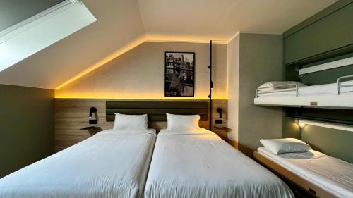 Postel nebo postele na pokoji v ubytování Campanile Hotel & Restaurant Zwolle