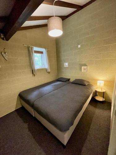 a bedroom with a large bed in a room at Le Vieux Sart 6 Coo - Stavelot in Stavelot