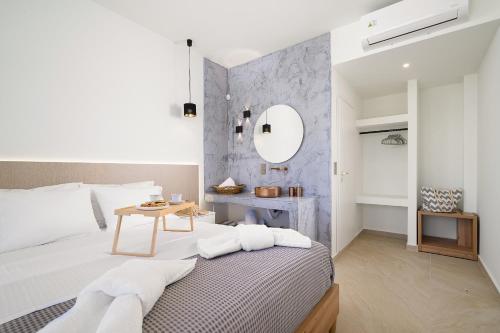 Ένα ή περισσότερα κρεβάτια σε δωμάτιο στο Theros Seaside Suite