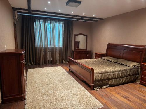 Ένα ή περισσότερα κρεβάτια σε δωμάτιο στο Apartment KZ Qonaev