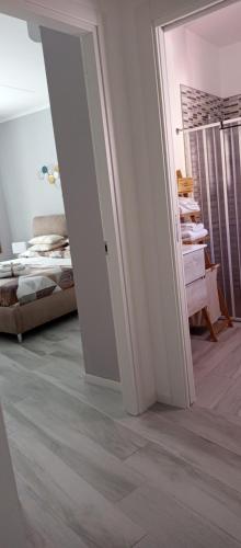 an open doorway to a bedroom with a bed at Casa vacanza Luna in Eboli