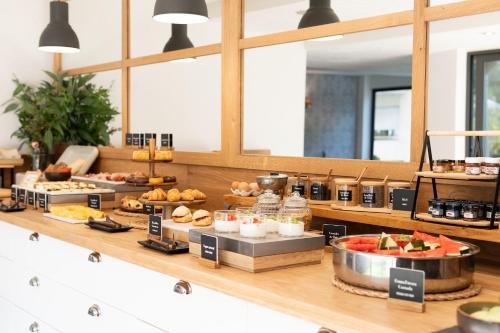 a buffet line with different types of food on display at Arenas Atiram Hotel in Barcelona