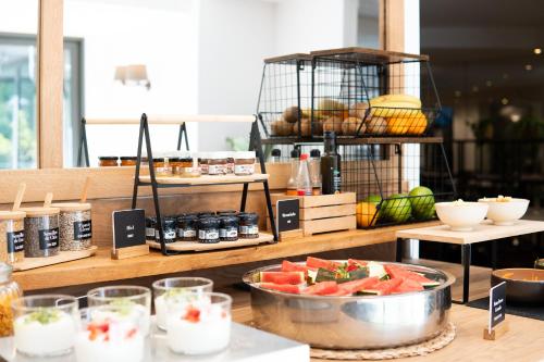 a table with a bowl of watermelon on a counter at Arenas Atiram Hotel in Barcelona
