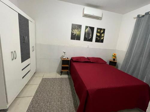 En eller flere senge i et værelse på Minha Casa Seu Lar