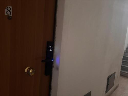 a door with a blue light in a room at Apartment Sun&Sea Durres by Sasha in Durrës