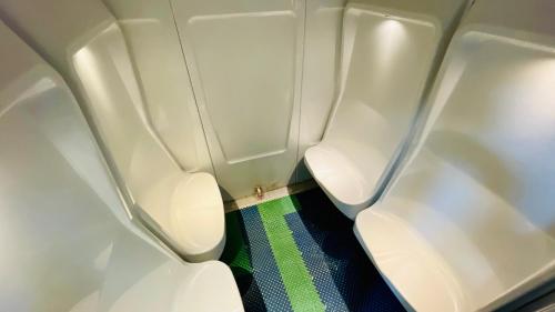 a bathroom with two toilets on an airplane at Aselefech Merga Hotel and Spa in Addis Ababa