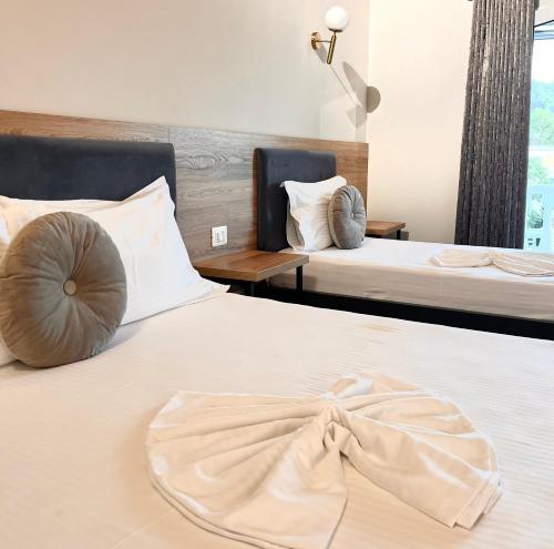 Postel nebo postele na pokoji v ubytování Mili Hotel