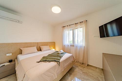 Postel nebo postele na pokoji v ubytování Villa Vita - Vela Luka