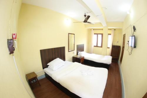 Cama o camas de una habitación en HOTEL GORKHA BISAUNi Best Hotel in Gorkha