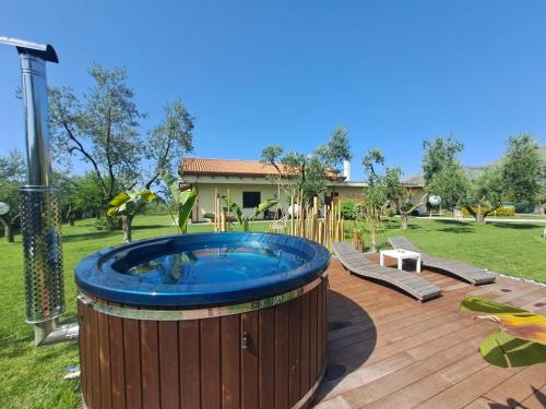 a large hot tub in a yard with a house at La Campagna di Peppe e Tullia in Formia