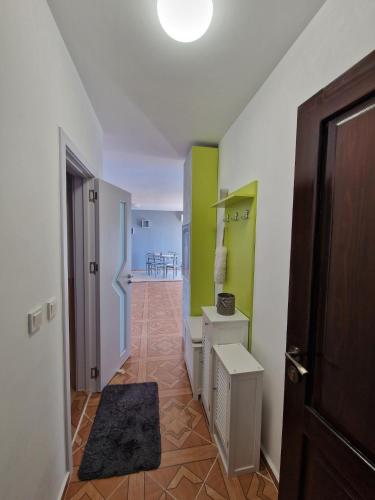 a hallway with a room with green and white walls at LOVE 2 apartment in Aheloy