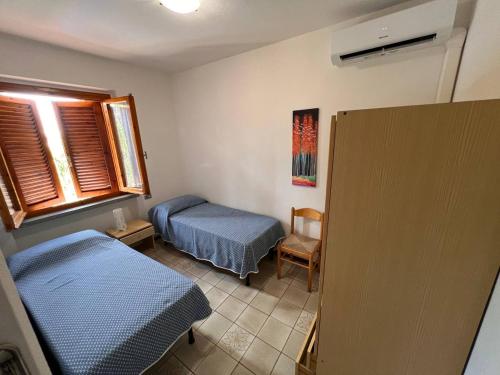 Postel nebo postele na pokoji v ubytování Residence Delfini