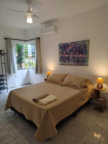 Ένα ή περισσότερα κρεβάτια σε δωμάτιο στο Jardim das Mangueiras