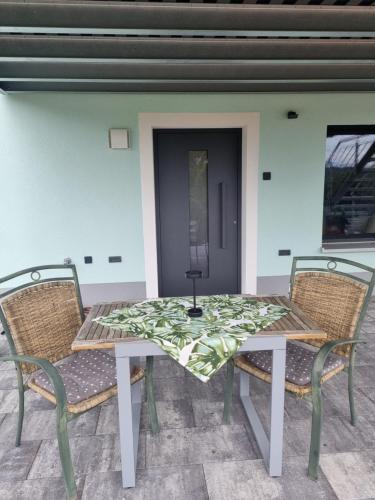 a table and chairs sitting on a patio at Hideaway Eyb in Ansbach